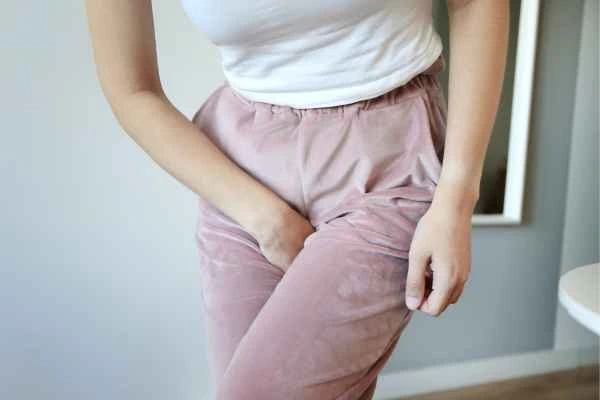 woman running for the toilet because of urinary incontinence Crewe